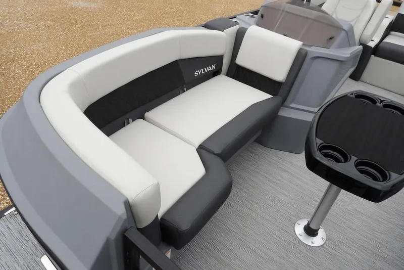Slide: The Image of 2026 Sylvan R-20 CLZ DH boat interior with plush seating and cup holders. - 21