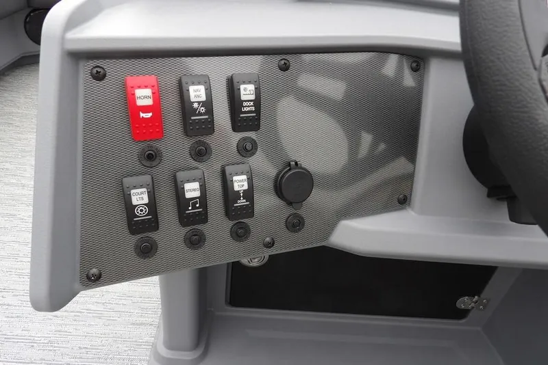 Slide: The Image of Control panel of 2026 Sylvan R-20 CLZ DH boat with various switches and buttons. - 28