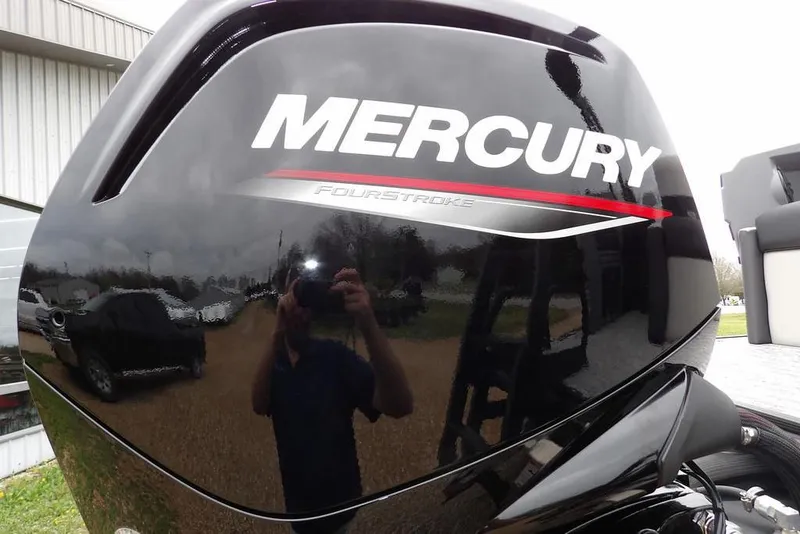 Slide: The Image of Mercury FourStroke engine on 2026 Sylvan R-20 CLZ DH boat, reflecting surroundings. - 34