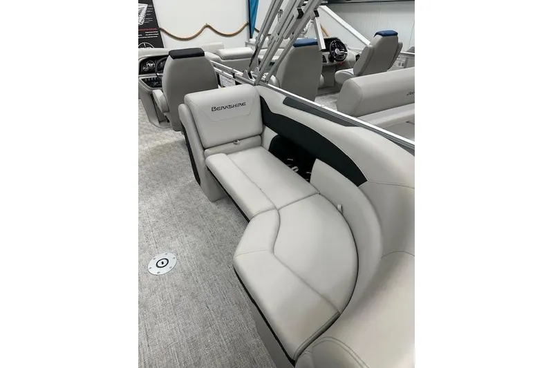 Slide: The Image of Luxurious interior of 2026 Berkshire 24RFX LE pontoon boat with plush seating. - 11