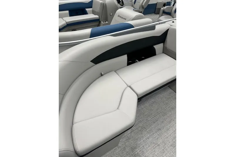 Slide: The Image of 2026 Berkshire 24RFX LE boat interior with sleek white and blue seating. - 17