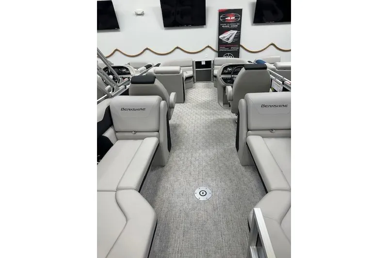 Slide: The Image of 2026 Berkshire 24RFX LE pontoon boat interior with luxurious seating and modern design. - 9