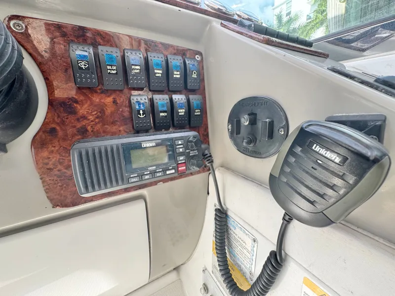 Slide: The Image of Control panel of a 2004 Formula 37 Performance Cruiser with switches and radio. - 17