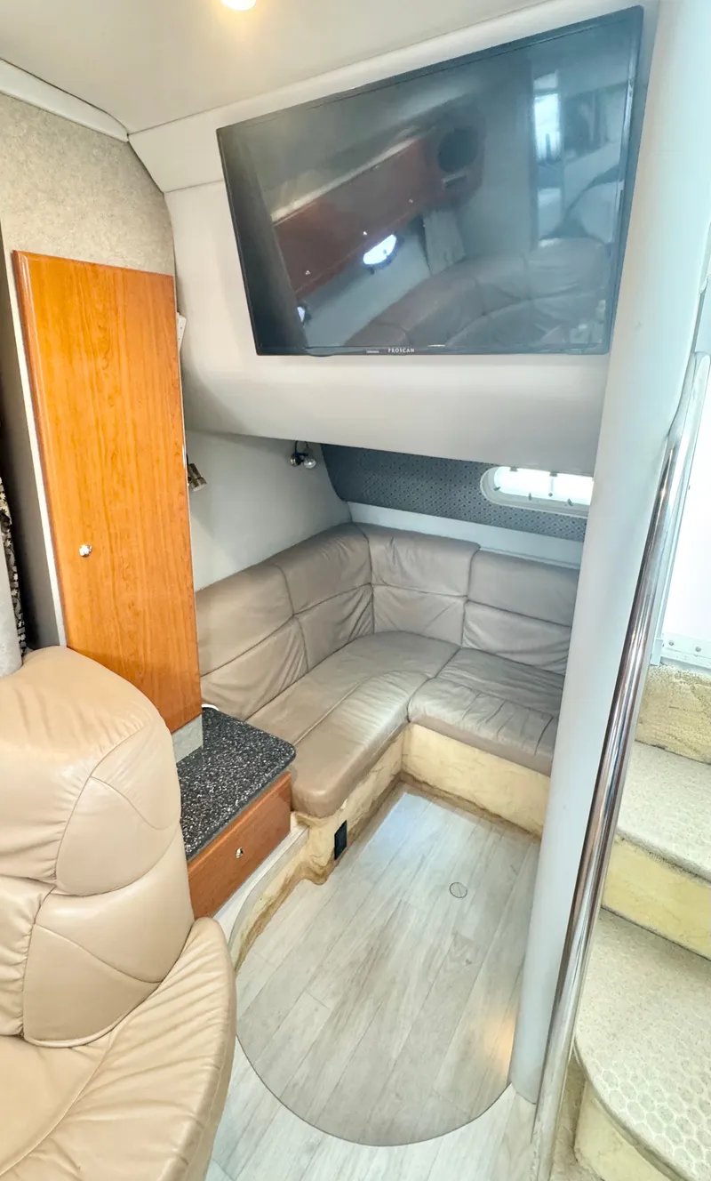 Slide: The Image of Interior of 2004 Formula 37 Performance Cruiser with leather sofa and TV. - 22