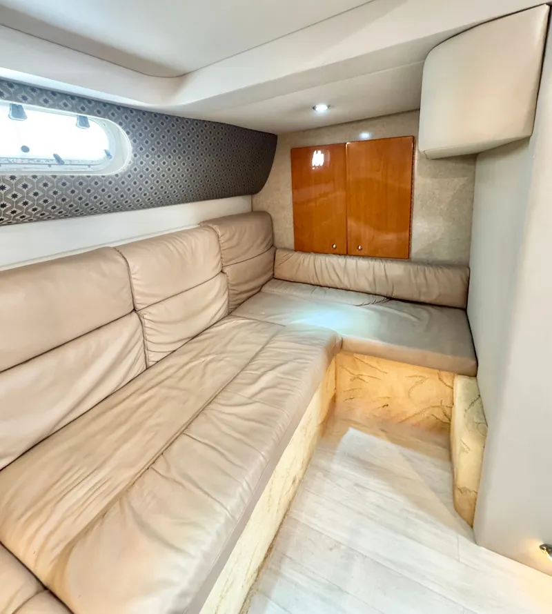 Slide: The Image of Interior of a 2004 Formula 37 Performance Cruiser with beige sofa. - 24