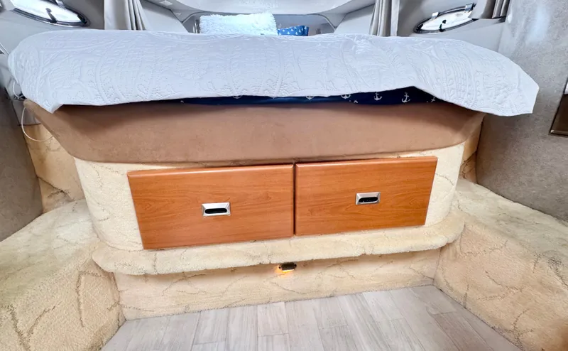 Slide: The Image of Interior of a 2004 Formula 37 Performance Cruiser with storage under the bed. - 32