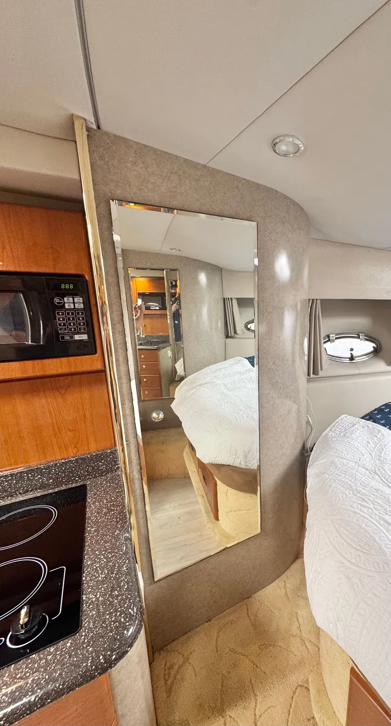 Slide: The Image of Interior of a 2004 Formula 37 Performance Cruiser with kitchen and bed. - 33