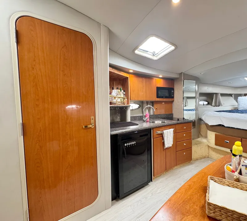 Slide: The Image of Interior of a 2004 Formula 37 Performance Cruiser with kitchen and sleeping area. - 35