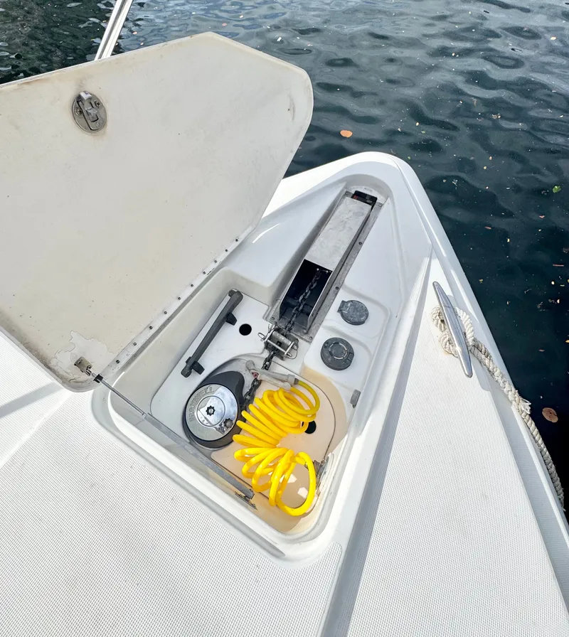 Slide: The Image of Anchor compartment of 2004 Formula 37 Performance Cruiser with yellow hose. - 38