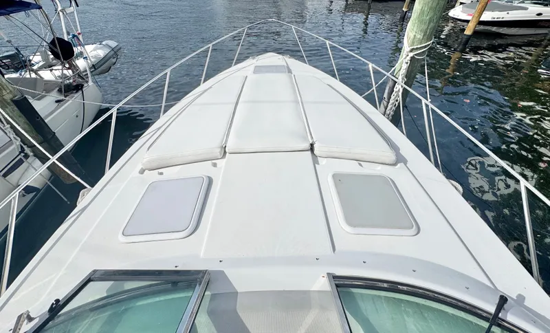 Slide: The Image of 2004 Formula 37 Performance Cruiser docked on the water. - 41