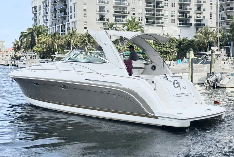 Slide: The Image of 2004 Formula 37 Performance Cruiser docked near high-rise buildings. - 5