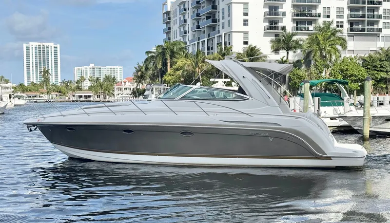 Slide: The Image of 2004 Formula 37 Performance Cruiser near modern buildings. - 6