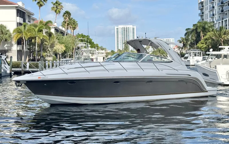 Slide: The Image of 2004 Formula 37 Performance Cruiser on water with palm trees. - 7