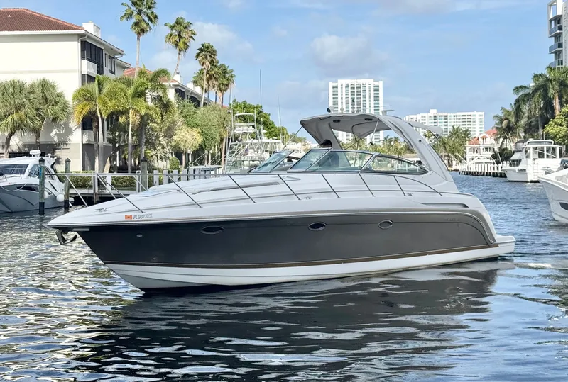 Slide: The Image of 2004 Formula 37 Performance Cruiser on water with palm trees. - 9