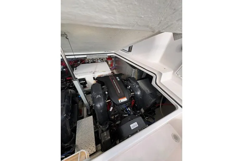 Slide: The Image of Engine compartment of a 2013 Regal 35 Express Cruiser, showcasing mechanical components. - 21