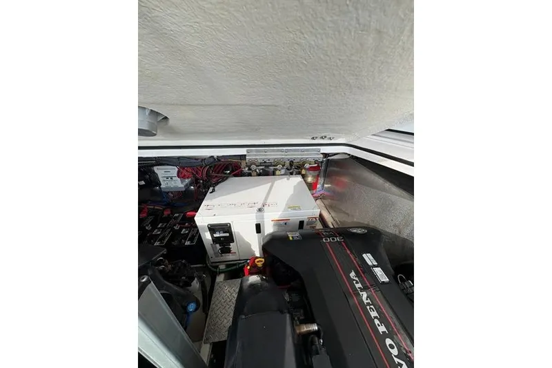 Slide: The Image of Engine compartment of a 2013 Regal 35 Express Cruiser with Volvo Penta components. - 24
