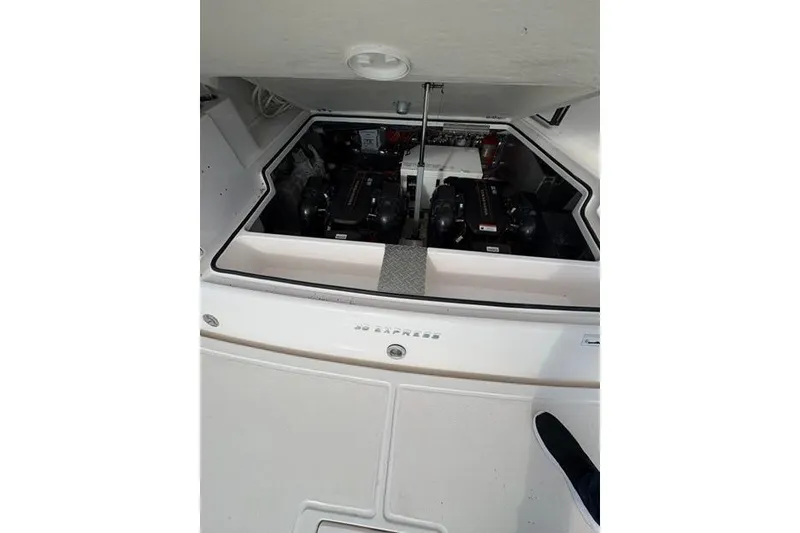 Slide: The Image of Engine compartment of a 2013 Regal 35 Express Cruiser, showcasing dual engines. - 26