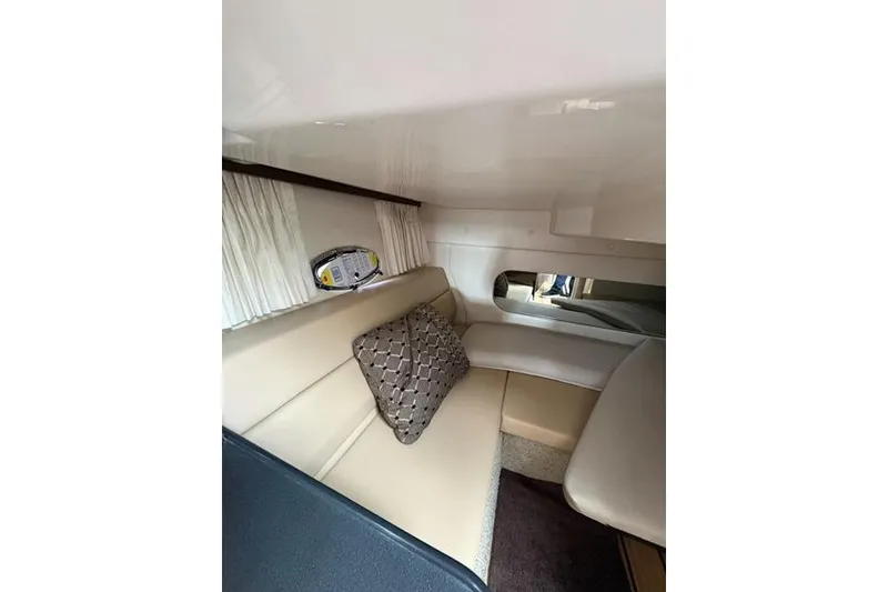 Slide: The Image of Interior of 2013 Regal 35 Express Cruiser with beige seating and decorative pillow. - 39