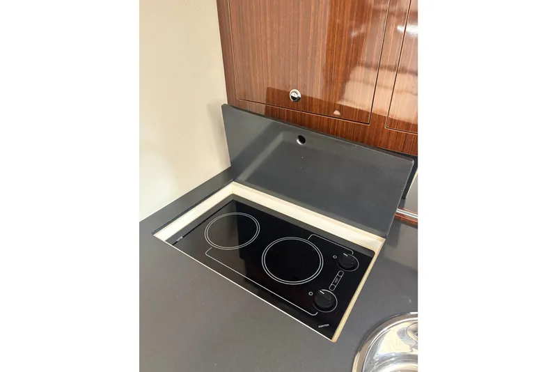 Slide: The Image of Modern stovetop in 2013 Regal 35 Express Cruiser yacht kitchen. - 43