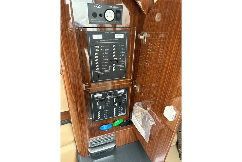 Slide: The Image of Control panel of a 2013 Regal 35 Express Cruiser with wood finish. - 46