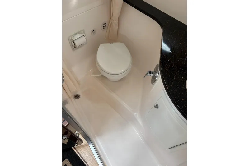 Slide: The Image of Bathroom interior of 2013 Regal 35 Express Cruiser with toilet and countertop. - 49
