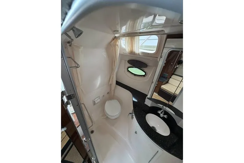 Slide: The Image of Bathroom interior of 2013 Regal 35 Express Cruiser with shower, toilet, and sink. - 50