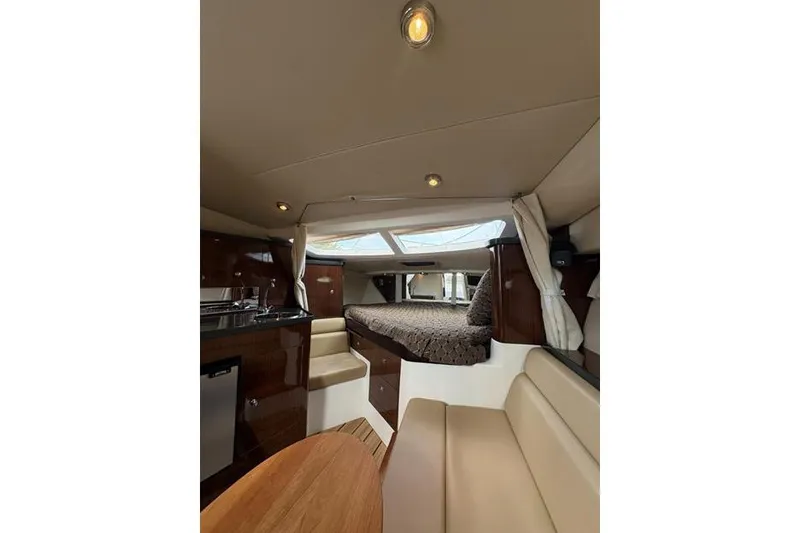 Slide: The Image of Luxurious interior of 2013 Regal 35 Express Cruiser with cozy seating and elegant design. - 52