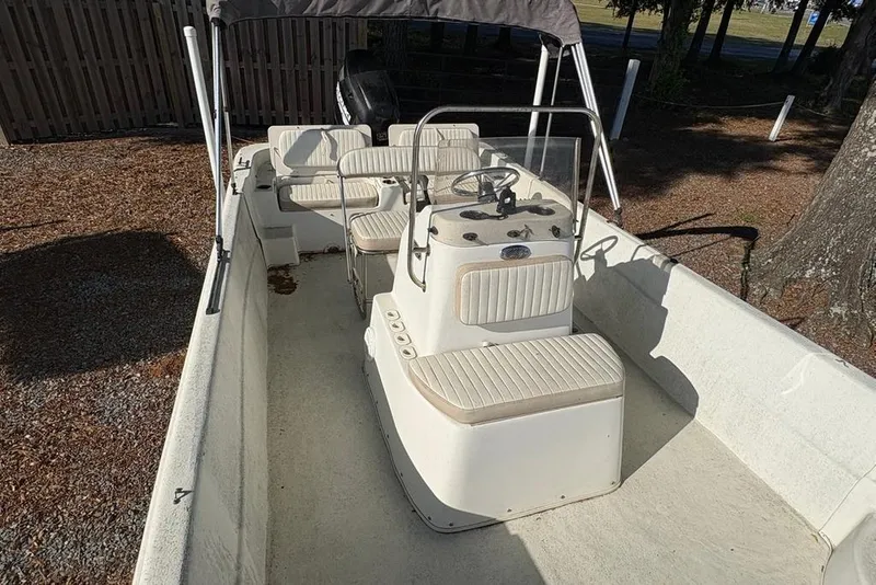 Slide: The Image of 2014 Carolina Skiff 218 DLV boat interior with seating and steering console. - 11