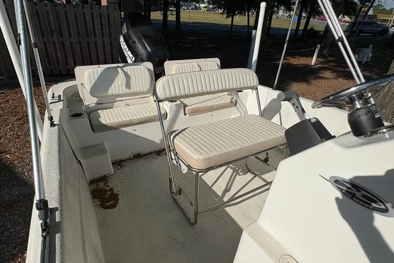 Slide: The Image of 2014 Carolina Skiff 218 DLV boat interior with seating and steering console. - 14