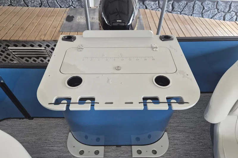 Slide: The Image of Fishing station on 2026 Sylvan Mirage Fish 820 Party Fish boat, featuring rod holders and cup holders. - 11