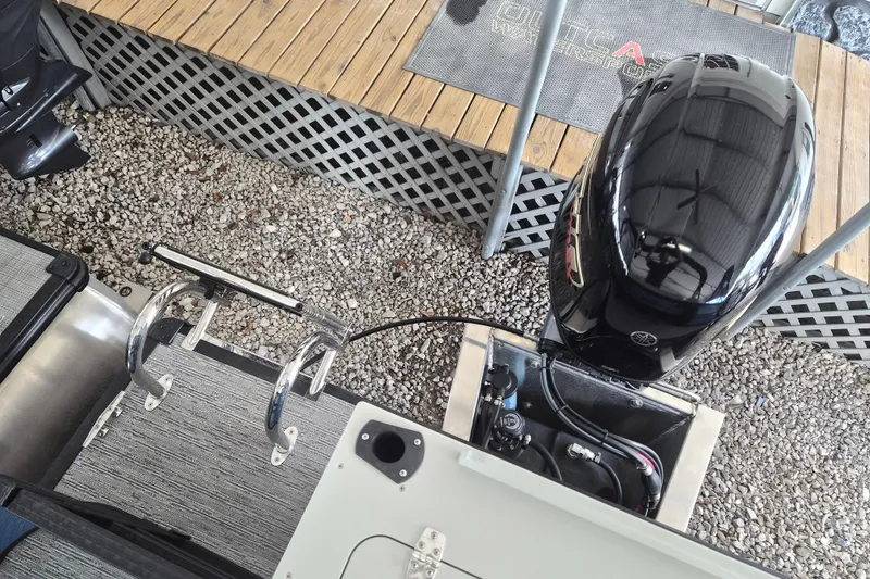 Slide: The Image of 2026 Sylvan Mirage Fish 820 Party Fish boat engine and deck view. - 12