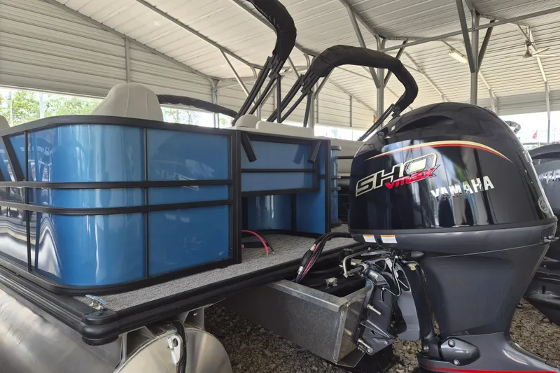 Slide: The Image of 2026 Sylvan Mirage Fish 820 Party Fish pontoon with Yamaha outboard motor in covered storage. - 13