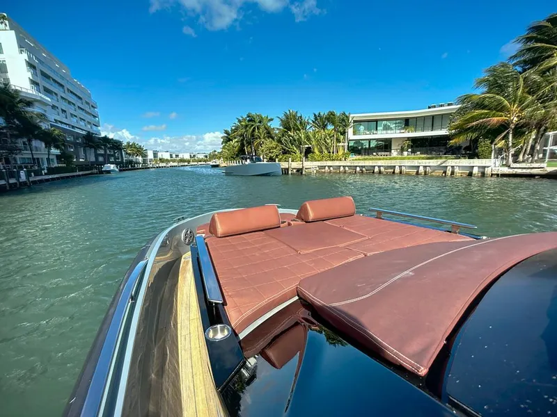 Slide: The Image of 2019 SACS Rebel 40 yacht cruising in a sunny, tropical canal setting. - 17
