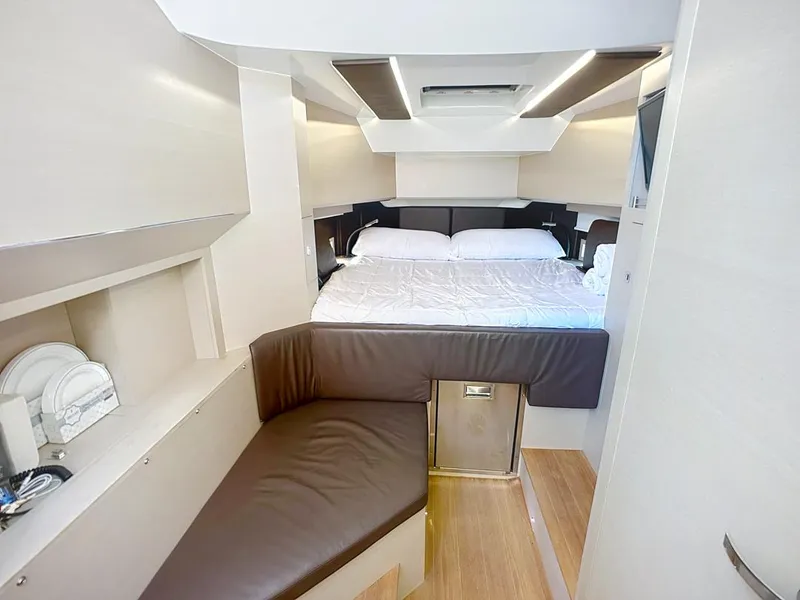 Slide: The Image of Luxurious interior of 2019 SACS Rebel 40 yacht with cozy bed and seating area. - 25