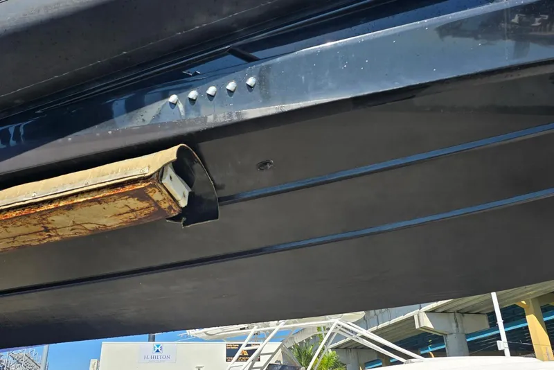 Slide: The Image of Underside view of a 2019 SACS Rebel 40 boat hull with visible wear. - 43