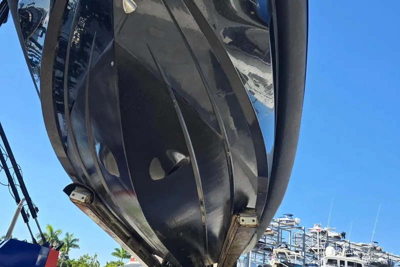 Slide: The Image of Underside view of 2019 SACS Rebel 40 boat against clear blue sky. - 44