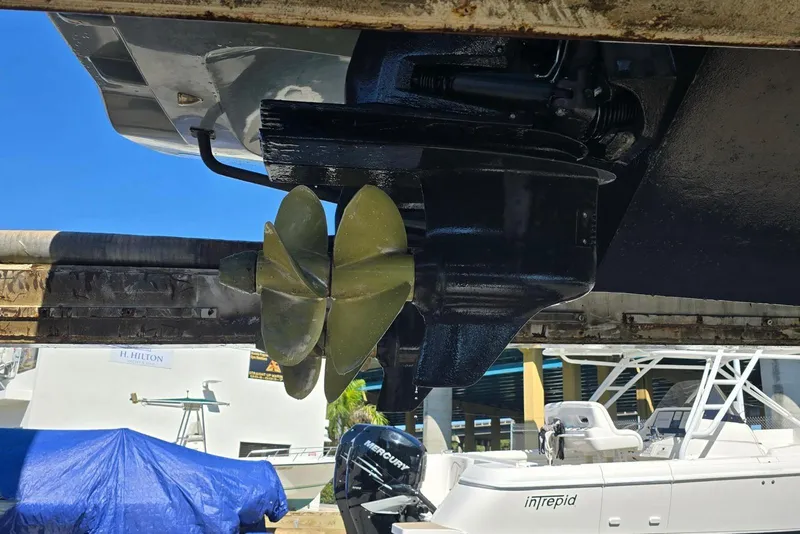 Slide: The Image of Propeller of 2019 SACS Rebel 40 boat, docked with other vessels in the background. - 46