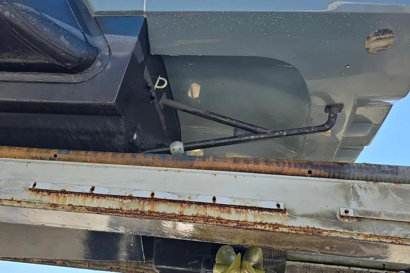 Slide: The Image of Close-up of 2019 SACS Rebel 40 boat hull and propeller on a lift. - 48