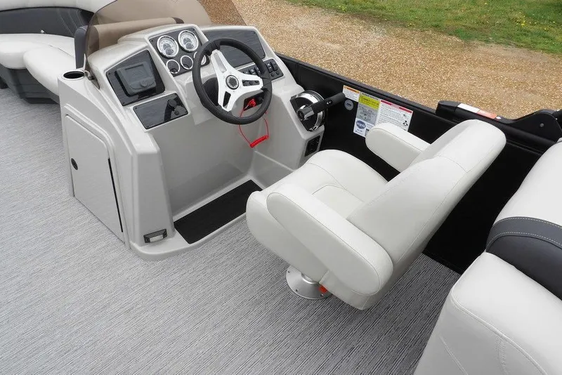 Slide: The Image of 2026 Sylvan 8522 LZ boat interior with modern steering console and comfortable seating. - 10