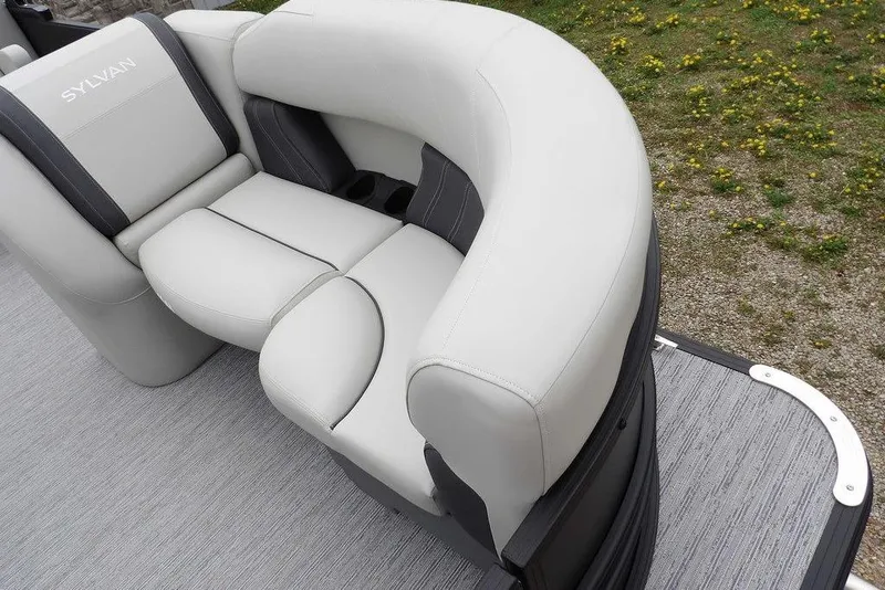 Slide: The Image of Luxurious seating on 2026 Sylvan 8522 LZ pontoon boat, featuring sleek gray upholstery. - 12