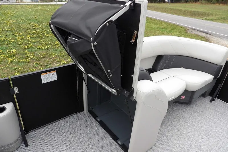 Slide: The Image of 2026 Sylvan 8522 LZ boat interior with seating and storage compartment. - 14
