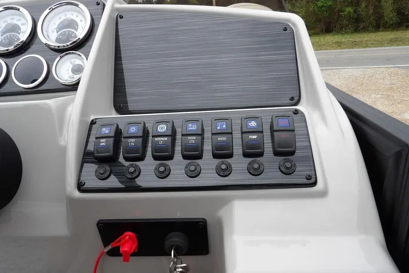 Slide: The Image of Control panel of 2026 Sylvan 8522 LZ boat with switches and gauges. - 17