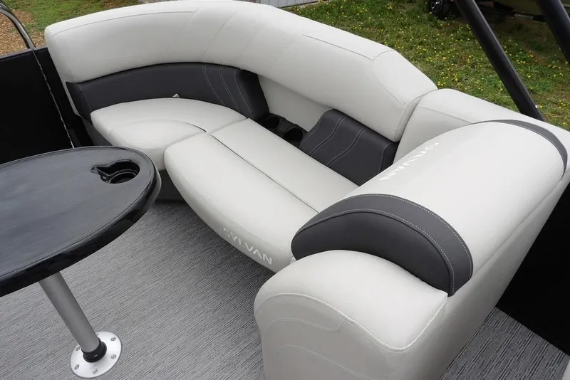 Slide: The Image of Luxurious seating on 2026 Sylvan 8522 LZ pontoon boat with sleek design and table. - 21