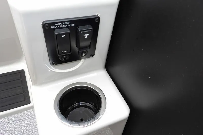 Slide: The Image of Control panel and cup holder on 2026 Sylvan 8522 LZ boat. - 22