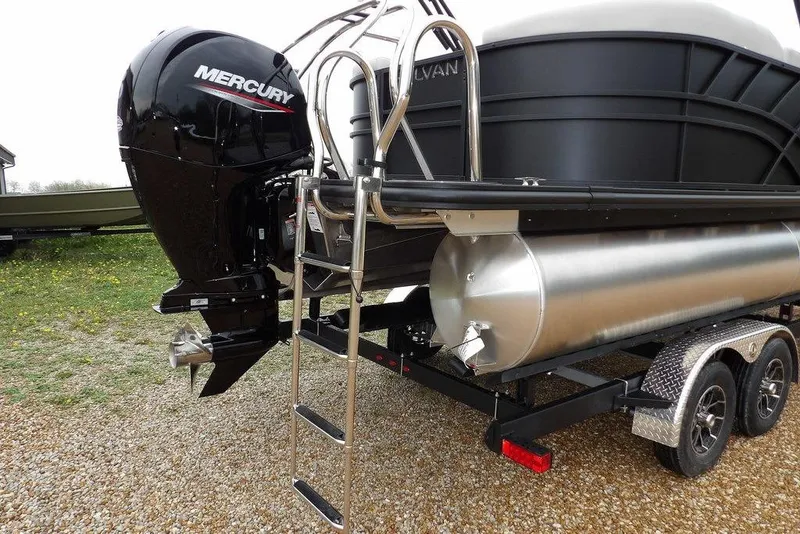 Slide: The Image of 2026 Sylvan 8522 LZ pontoon boat with Mercury outboard motor on trailer. - 24