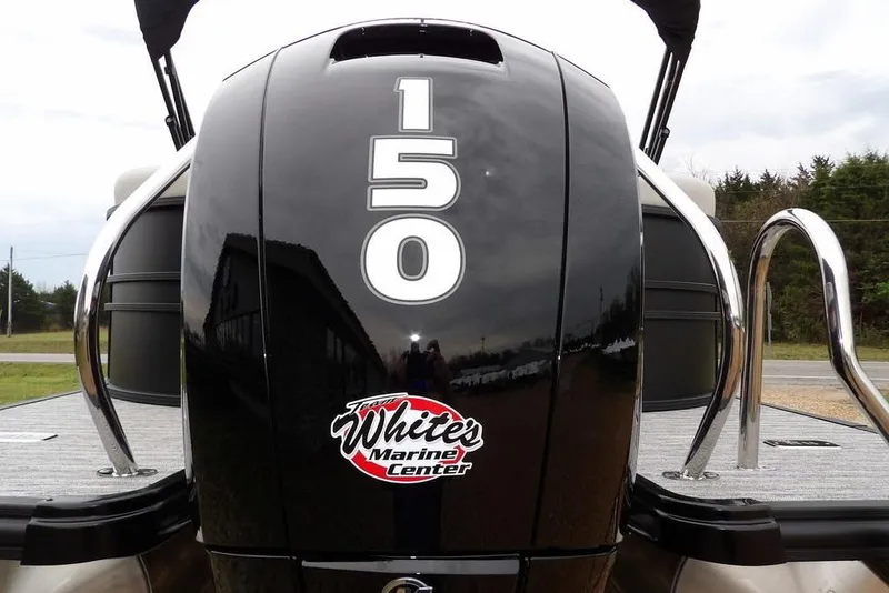 Slide: The Image of Outboard motor on 2026 Sylvan 8522 LZ pontoon boat, featuring "150" and "White's Marine Center" logo. - 27