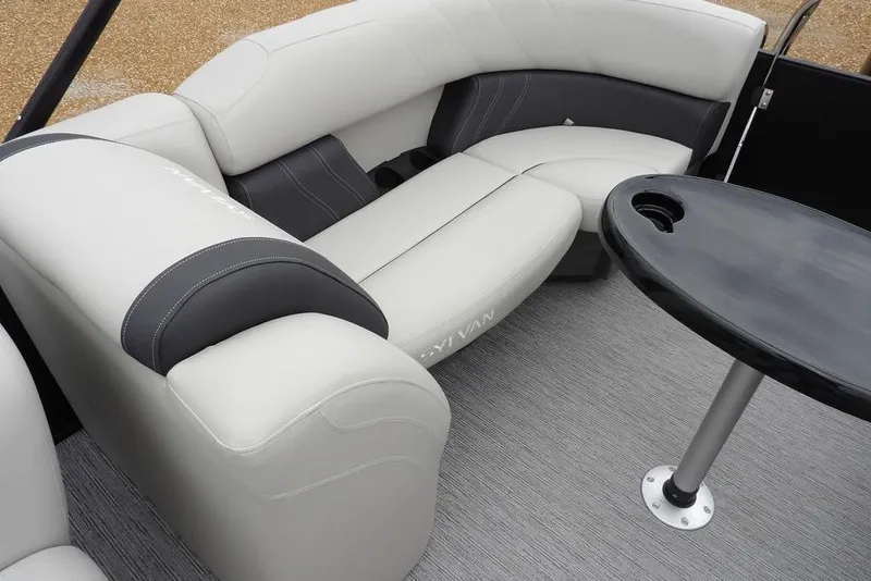 Slide: The Image of Luxurious seating on 2026 Sylvan 8522 LZ pontoon boat with sleek table design. - 31