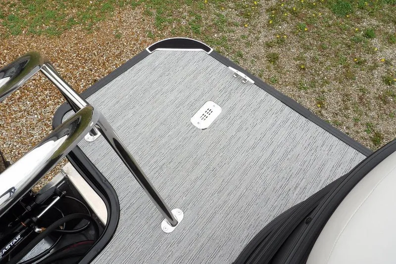 Slide: The Image of 2026 Sylvan 8522 LZ boat deck with sleek metal railing and textured flooring. - 33