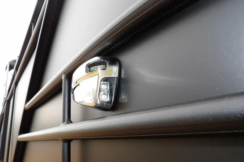 Slide: The Image of Close-up of a 2026 Sylvan 8522 LZ boat's sleek exterior detail. - 39