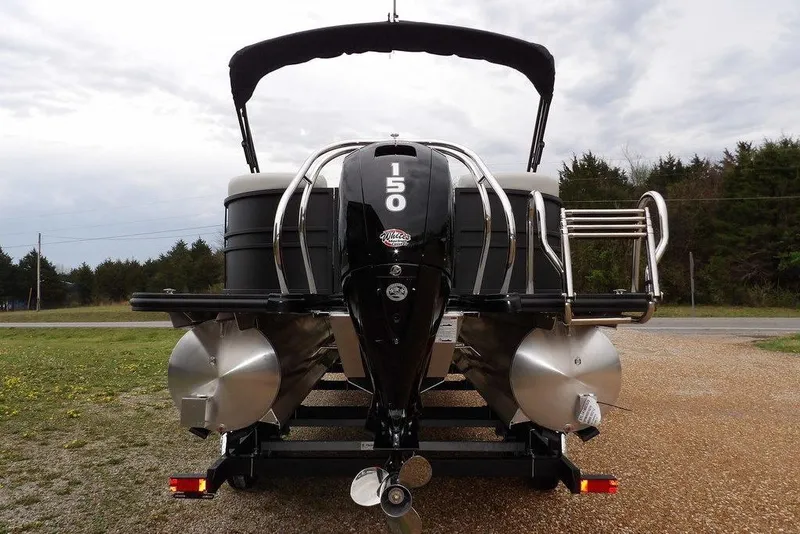 Slide: The Image of 2026 Sylvan 8522 LZ pontoon boat rear view with powerful outboard motor. - 4